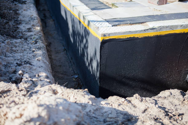 Professional Waterproofing technician working in Wheaton, MD